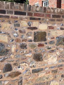 Close up of the completed flint stone wall