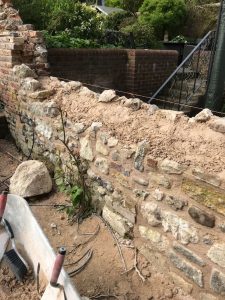 Rebuilding the flint wall