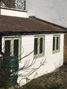 Side view of the completed outhouse