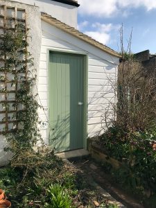 Entrance door to the completed outhouse